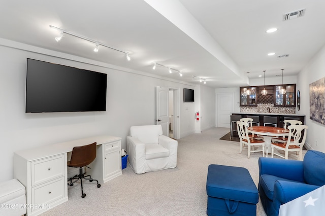 63 Bingham Ave, Rumson, NJ 07760 - living room featuring bar with sink, an office area, track lighting, light colored carpet, and recessed lighting