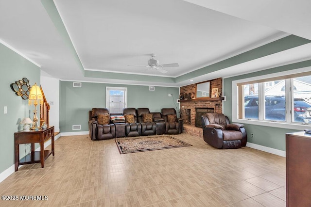 102 W Colony Rd, Lavallette, NJ 08735 - living area with a tray ceiling, a ceiling fan, and a brick fireplace