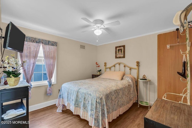 102 W Colony Rd, Lavallette, NJ 08735 - bedroom with wood finished floors, ornamental molding, and ceiling fan