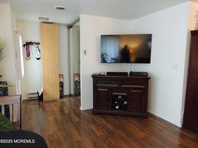 455A Chesterfield Ct, Manchester, NJ 08759 - living area with a baseboard radiator and dark wood-style floors