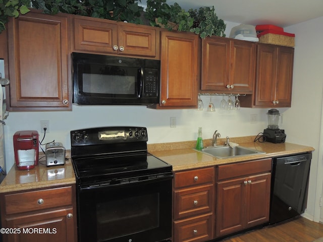 455A Chesterfield Ct, Manchester, NJ 08759 - kitchen featuring black appliances, light countertops, and brown cabinets