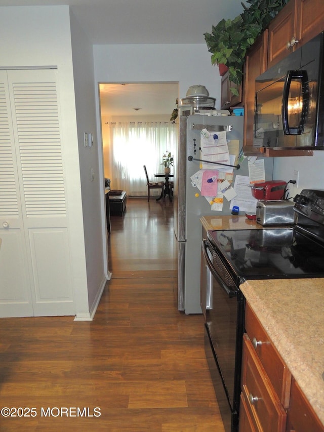 455A Chesterfield Ct, Manchester, NJ 08759 - kitchen with black appliances, dark wood finished floors, and light countertops