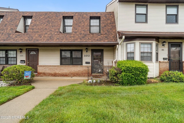 103 Village Green Way, Hazlet, NJ 07730 - multi unit property with a shingled roof, a front yard, and brick siding