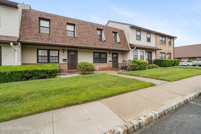 103 Village Green Way, Hazlet, NJ 07730 - townhome / multi-family property featuring a shingled roof, a front yard, and brick siding