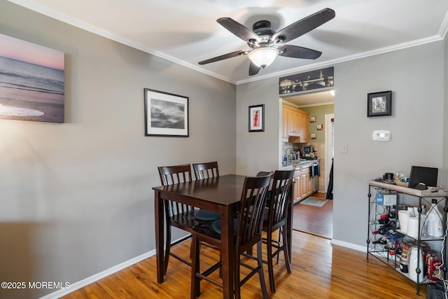103 Village Green Way, Hazlet, NJ 07730 - dining space featuring a ceiling fan, light wood-style flooring, and ornamental molding