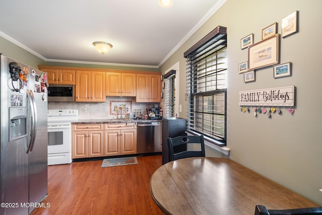 103 Village Green Way, Hazlet, NJ 07730 - kitchen featuring stainless steel appliances, dark wood finished floors, ornamental molding, and tasteful backsplash