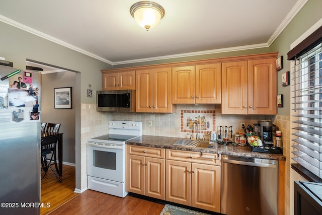 103 Village Green Way, Hazlet, NJ 07730 - kitchen with stainless steel appliances, ornamental molding, wood finished floors, backsplash, and dark stone counters
