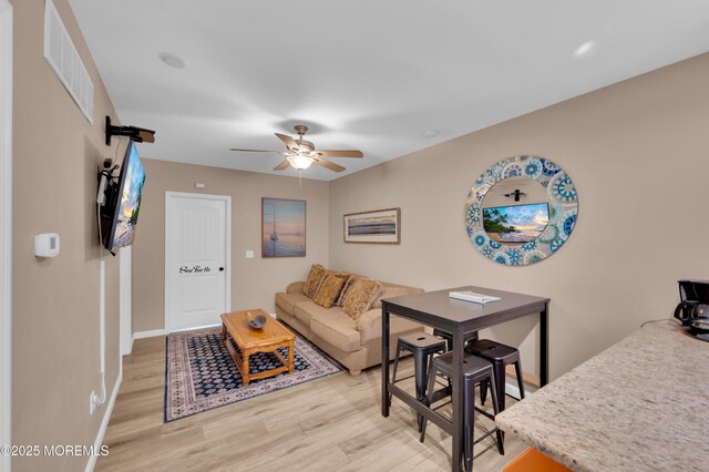 241 Hiering Ave, Seaside Heights, NJ 08751 - living room with light wood-style floors and a ceiling fan