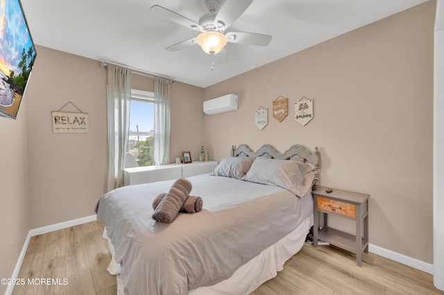 241 Hiering Ave, Seaside Heights, NJ 08751 - bedroom with wood finished floors, a ceiling fan, and a wall mounted air conditioner