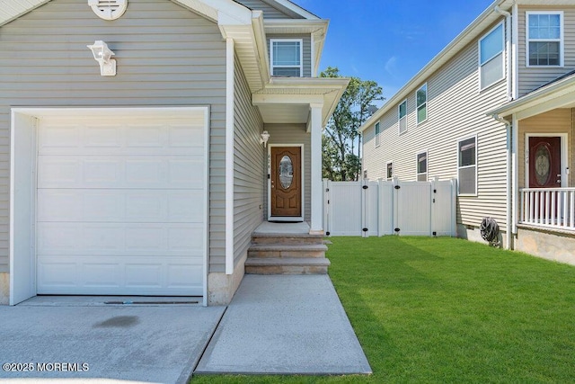 626 Anthony Ave, Toms River, NJ 08753 - view of exterior entry with a garage and a gate