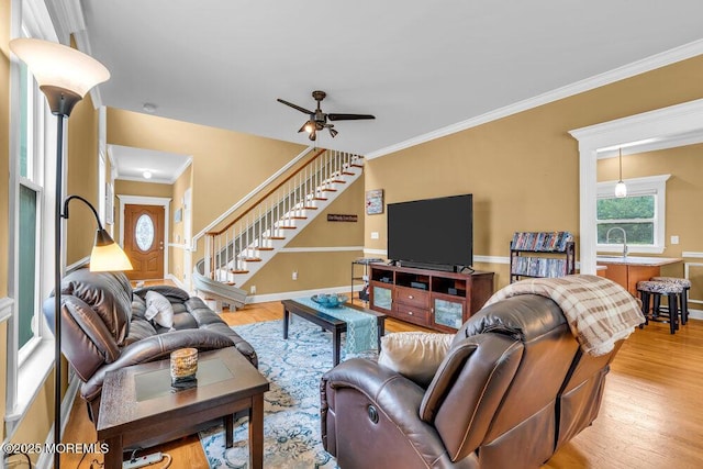 626 Anthony Ave, Toms River, NJ 08753 - living room featuring stairs, light wood finished floors, ceiling fan, and crown molding