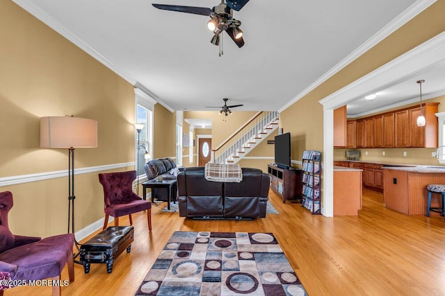 626 Anthony Ave, Toms River, NJ 08753 - living area with a ceiling fan, light wood-style floors, stairs, and ornamental molding