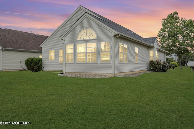 10 Ignatius Dr, Manchester, NJ 08759 - rear view of house featuring a lawn and roof with shingles
