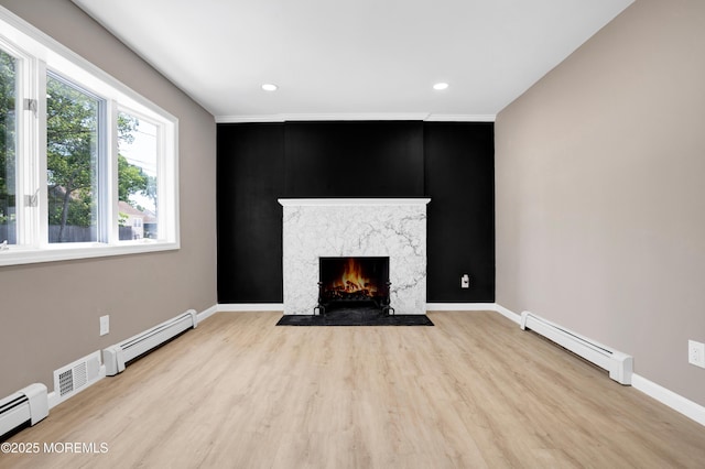 30 Stuyvesant Rd, Brick, NJ 08723 - unfurnished living room with a baseboard heating unit, a premium fireplace, wood finished floors, and recessed lighting