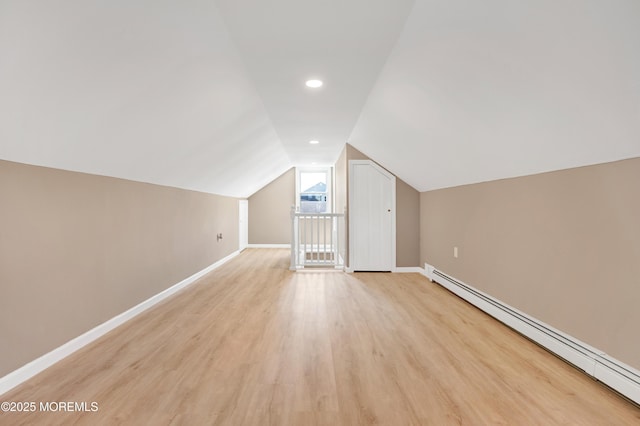 30 Stuyvesant Rd, Brick, NJ 08723 - bonus room featuring a baseboard radiator, vaulted ceiling, and light wood-style flooring