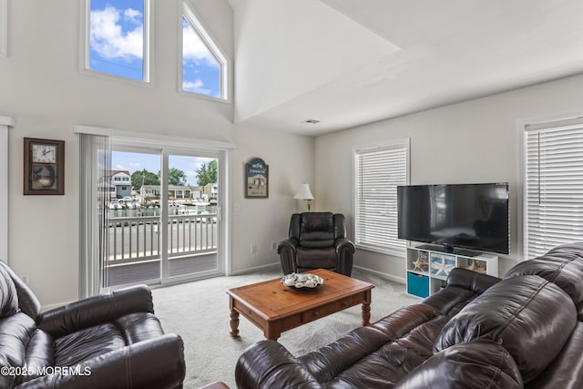21 Seabreeze Rd, Toms River, NJ 08753 - carpeted living area featuring baseboards and a towering ceiling