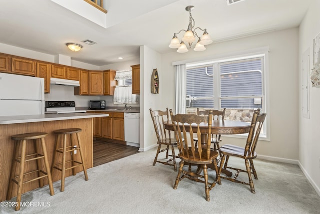 21 Seabreeze Rd, Toms River, NJ 08753 - dining area featuring carpet flooring and a chandelier