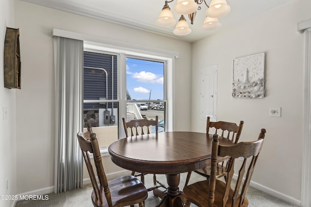 21 Seabreeze Rd, Toms River, NJ 08753 - carpeted dining area featuring baseboards and a chandelier