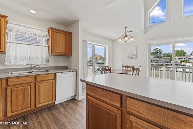 21 Seabreeze Rd, Toms River, NJ 08753 - kitchen featuring white dishwasher, a chandelier, dark wood-type flooring, brown cabinets, and light countertops