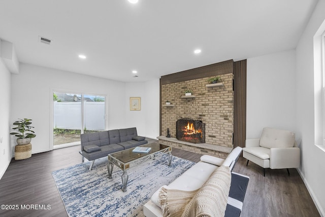 131 3rd St, Keyport, NJ 07735 - living room featuring wood finished floors, a brick fireplace, and recessed lighting