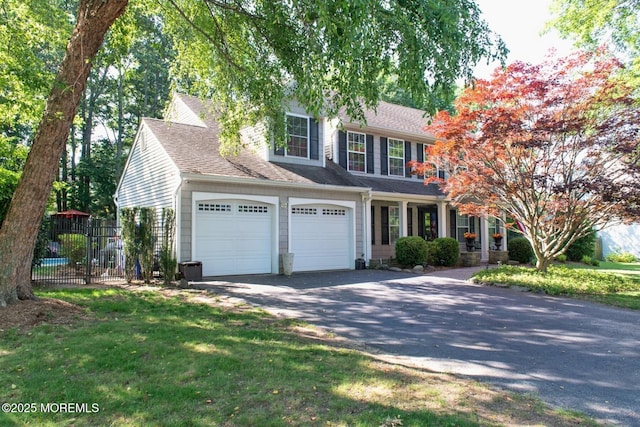 223 Kelly Lynn Ln, Brick, NJ 08724 - view of front of home featuring asphalt driveway, an attached garage, and roof with shingles