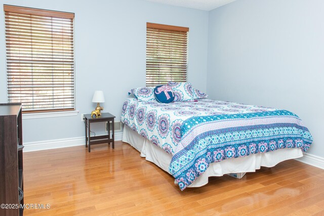 223 Kelly Lynn Ln, Brick, NJ 08724 - bedroom featuring wood finished floors and baseboards