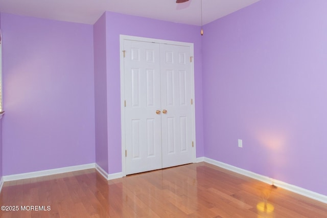 223 Kelly Lynn Ln, Brick, NJ 08724 - unfurnished bedroom with wood finished floors, a closet, and ceiling fan