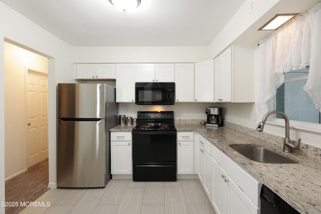 100 Courtshire Dr, Brick, NJ 08723 - kitchen featuring black appliances, white cabinets, and light stone countertops