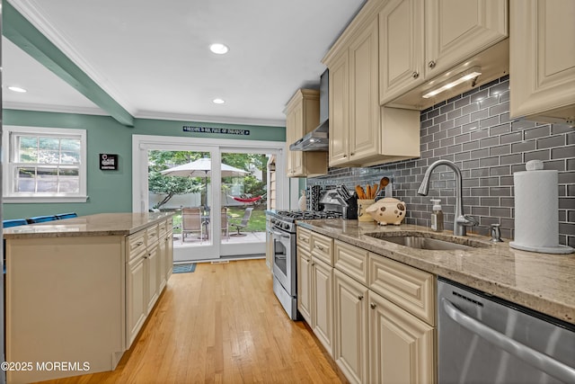 384 Gerry Rd, North Brunswick, NJ 08902 - kitchen featuring appliances with stainless steel finishes, cream cabinets, decorative backsplash, ornamental molding, and light wood-type flooring