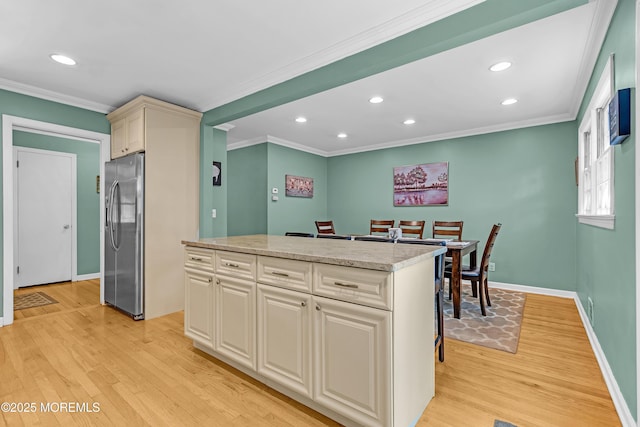 384 Gerry Rd, North Brunswick, NJ 08902 - kitchen with stainless steel refrigerator with ice dispenser, crown molding, light wood-type flooring, recessed lighting, and a center island