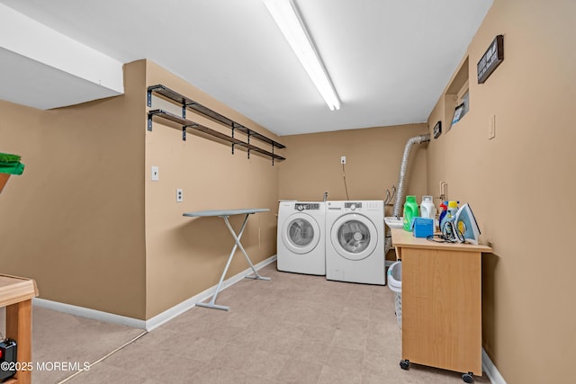 384 Gerry Rd, North Brunswick, NJ 08902 - laundry room with washer and dryer and tile patterned floors