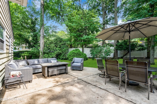 384 Gerry Rd, North Brunswick, NJ 08902 - fenced backyard with an outdoor hangout area, outdoor dining area, and a patio area