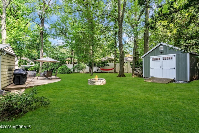 384 Gerry Rd, North Brunswick, NJ 08902 - fenced backyard with an outdoor fire pit, a shed, and a patio