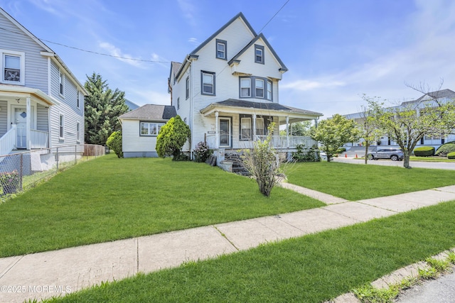 300 Atkins Ave, Neptune Township, NJ 07753 - victorian home featuring a porch and a front lawn