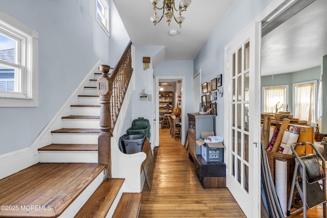 300 Atkins Ave, Neptune Township, NJ 07753 - entryway with hardwood / wood-style floors, stairway, french doors, and a chandelier