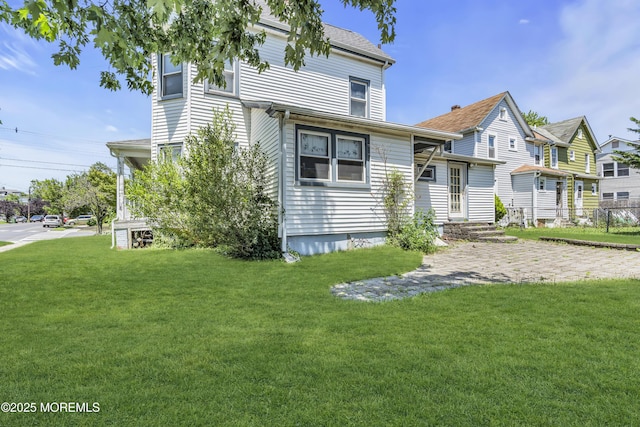 300 Atkins Ave, Neptune Township, NJ 07753 - rear view of house featuring a yard
