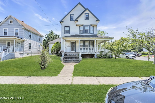 300 Atkins Ave, Neptune Township, NJ 07753 - victorian house featuring a porch and a front lawn