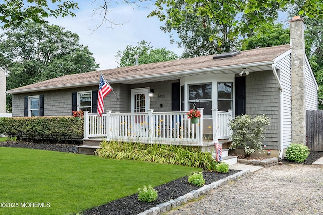 1425 Birmingham Ave, Toms River, NJ 08757 - view of front of house featuring a front lawn, a porch, a chimney, and roof with shingles
