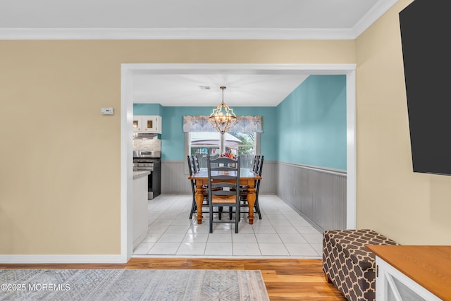 1425 Birmingham Ave, Toms River, NJ 08757 - dining room featuring light wood-style flooring, a chandelier, crown molding, and a wainscoted wall
