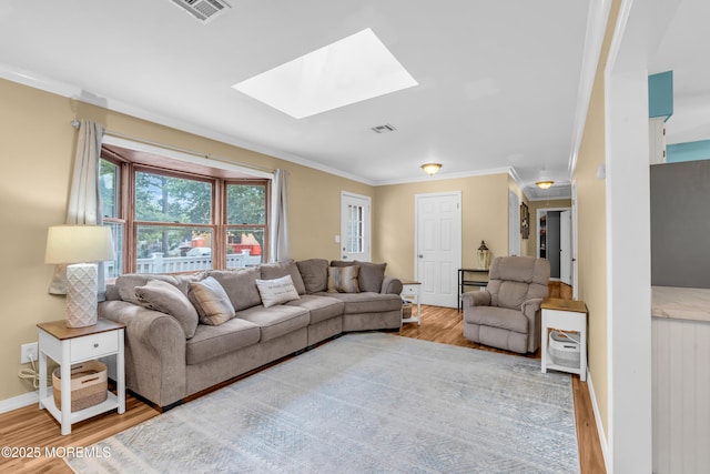 1425 Birmingham Ave, Toms River, NJ 08757 - living area featuring wood finished floors, crown molding, and a skylight