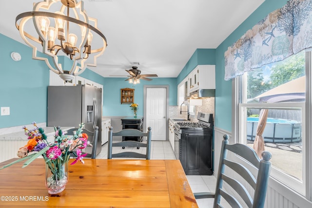 1425 Birmingham Ave, Toms River, NJ 08757 - dining area featuring a wainscoted wall, light tile patterned floors, a ceiling fan, a chandelier, and a desk