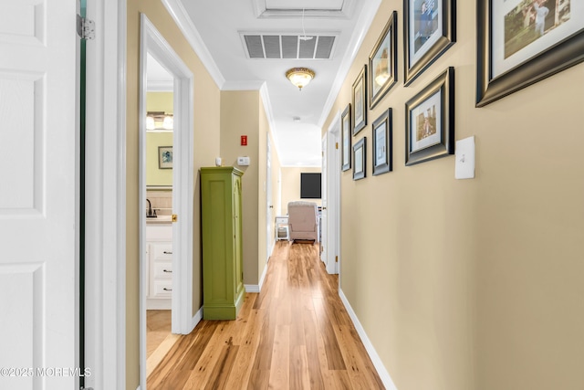 1425 Birmingham Ave, Toms River, NJ 08757 - hall with light wood-type flooring, attic access, and crown molding