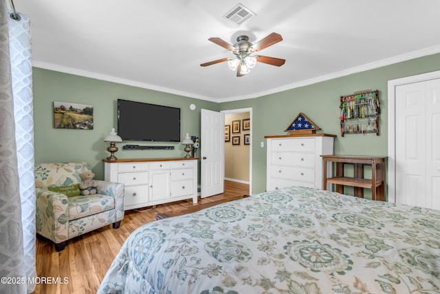 1425 Birmingham Ave, Toms River, NJ 08757 - bedroom featuring ornamental molding, wood finished floors, a ceiling fan, and a closet