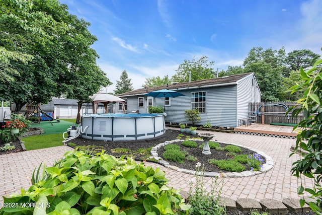 1425 Birmingham Ave, Toms River, NJ 08757 - back of house with a wooden deck, an outdoor pool, and a gazebo