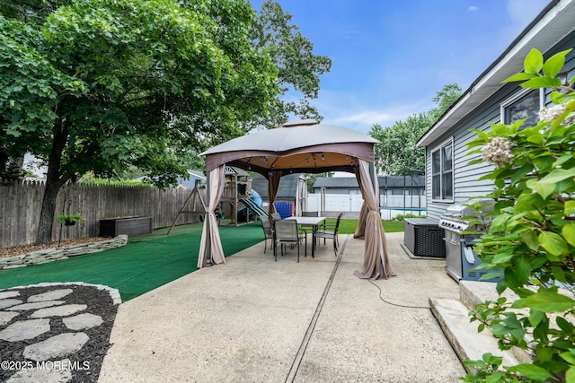 1425 Birmingham Ave, Toms River, NJ 08757 - fenced backyard featuring a gazebo, outdoor dining area, a patio, and area for grilling
