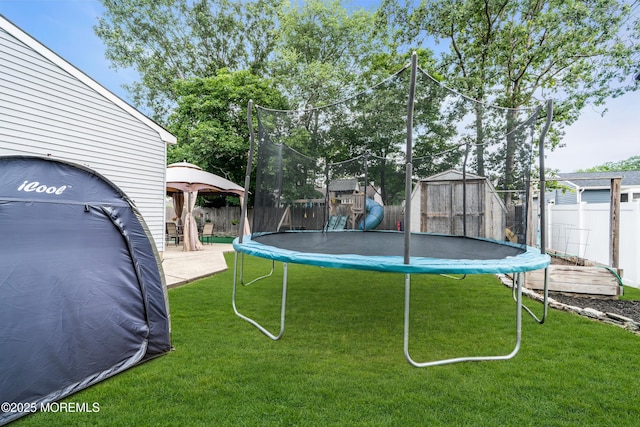 1425 Birmingham Ave, Toms River, NJ 08757 - fenced backyard with a trampoline, a gazebo, and a storage shed
