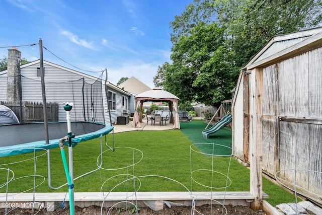 1425 Birmingham Ave, Toms River, NJ 08757 - fenced backyard with a trampoline, a gazebo, a playground, and a patio