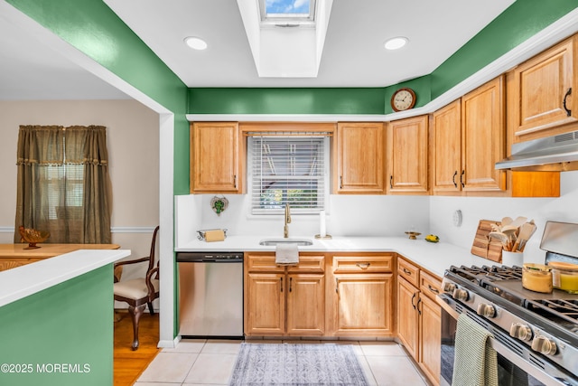 106 Northumberland Dr, Toms River, NJ 08757 - kitchen with appliances with stainless steel finishes, under cabinet range hood, light countertops, light tile patterned flooring, and recessed lighting