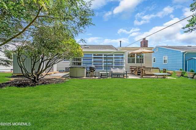 106 Northumberland Dr, Toms River, NJ 08757 - back of house with a patio area, a yard, and a chimney
