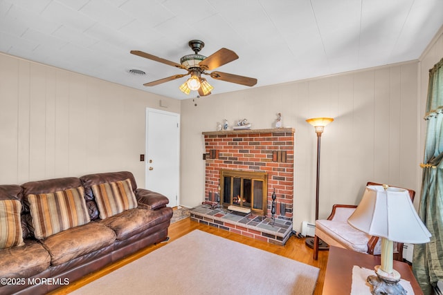 106 Northumberland Dr, Toms River, NJ 08757 - living area with wood finished floors, a fireplace, a baseboard radiator, and ceiling fan